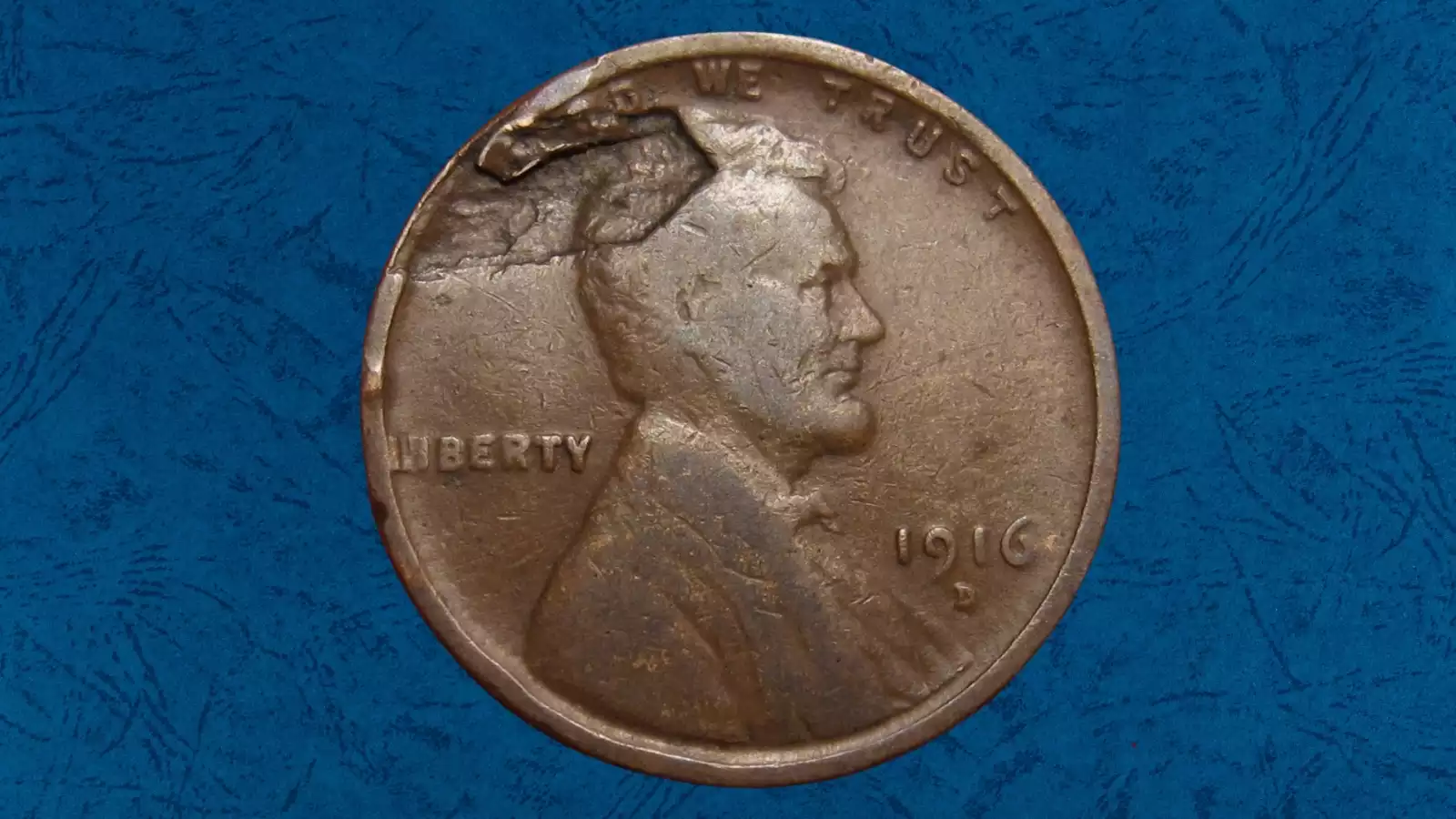 1916 wheat penny lamination error showing peeling copper surface layer on coin obverse